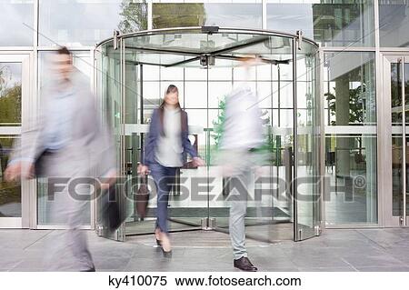 Business executives at entrance of an office building View Large Photo Image Stock Photography - Business executives at entrance of an office building. Fotosearch