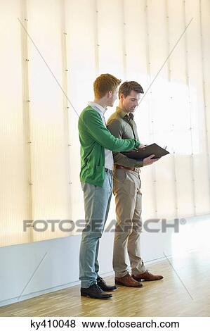 Business executives discussing View Large Photo Image Stock Photo - Business executives discussing. Fotosearch