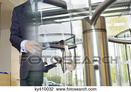 Reflection of business executives on window glass View Large Photo Image Stock Image - Reflection of business executives on window glass. Fotosearch