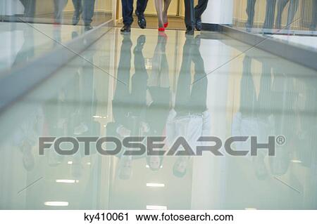 Reflection of business executives on the glassy floor View Large Photo Image Stock Image - Reflection of business executives on the glassy floor. Fotosearch