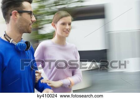 Young couple walking View Large Photo Image Picture - Young couple walking. Fotosearch