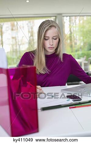 Businesswoman working in home office View Large Photo Image Stock Photo - Businesswoman working in home office. Fotosearch
