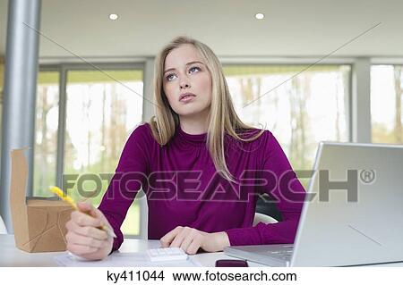 Businesswoman working in the home office View Large Photo Image Picture - Businesswoman working in the home office. Fotosearch