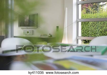 Stock Photography - Ecology sustainable development related photographs on a table. Fotosearch