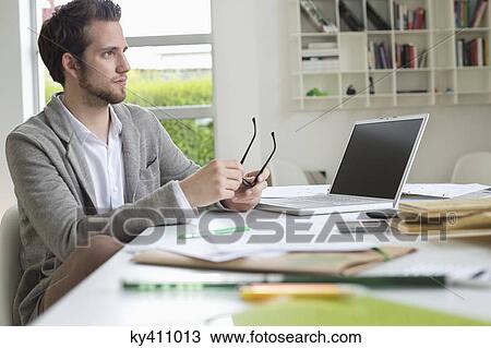 Interior designer working in the office View Large Photo Image Stock Image - Interior designer working in the office. Fotosearch