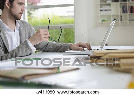 Interior designer working in the office View Large Photo Image Stock Image - Interior designer working in the office. Fotosearch