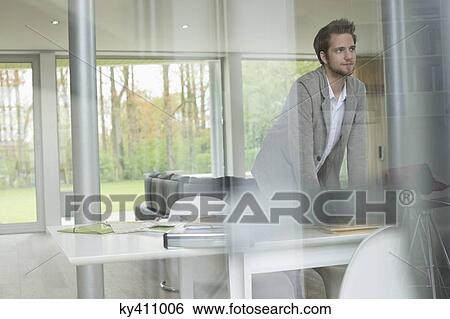 Interior designer working in the office View Large Photo Image Stock Photograph - Interior designer working in the office. Fotosearch