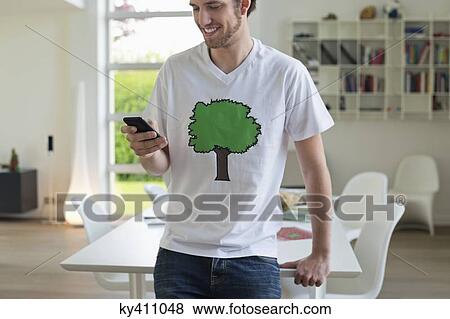 Stock Photo - Man using a mobile phone. Fotosearch