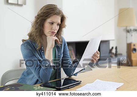 Woman sorting out bills View Large Photo Image Picture - Woman sorting out bills. Fotosearch