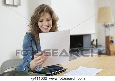 Woman sorting out bills View Large Photo Image Stock Image - Woman sorting out bills. Fotosearch