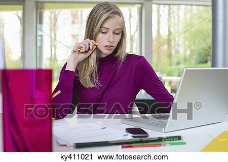 Woman working in home office View Large Photo Image Stock Image - Woman working in home office. Fotosearch