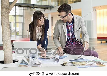 Architects working in an office View Large Photo Image Stock Image - Architects working in an office. Fotosearch
