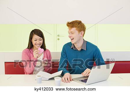 Business couple in an office View Large Photo Image Stock Image - Business couple in an office. Fotosearch