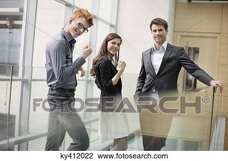 Business executives cheering up in an office View Large Photo Image Stock Image - Business executives cheering up in an office. Fotosearch