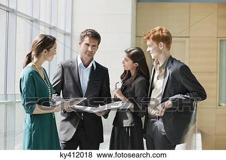 Business executives discussing in an office View Large Photo Image Stock Photo - Business executives discussing in an office. Fotosearch