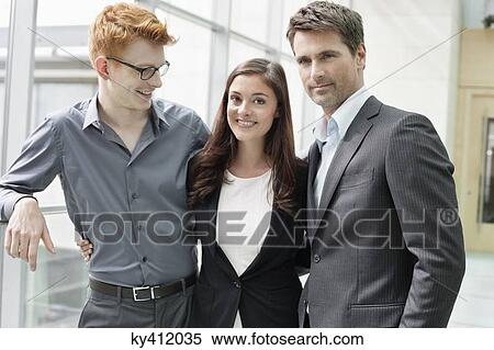 Business executives smiling in an office View Large Photo Image Stock Photography - Business executives smiling in an office. Fotosearch