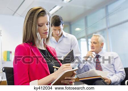 Business executives working in an office View Large Photo Image Picture - Business executives working in an office. Fotosearch