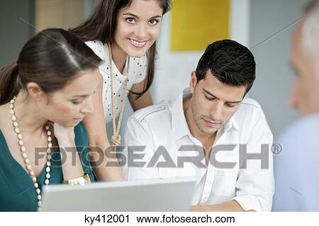 Business executives working in an office View Large Photo Image Stock Image - Business executives working in an office. Fotosearch