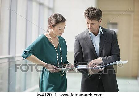 Business executives working in an office View Large Photo Image Stock Image - Business executives working in an office. Fotosearch