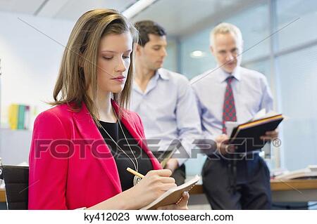 Business executives working in an office View Large Photo Image Stock Image - Business executives working in an office. Fotosearch