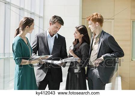 Business executives working in an office View Large Photo Image Stock Image - Business executives working in an office. Fotosearch