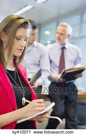 Business executives working in an office View Large Photo Image Stock Image - Business executives working in an office. Fotosearch