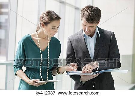 Business executives working in an office View Large Photo Image Stock Photo - Business executives working in an office. Fotosearch
