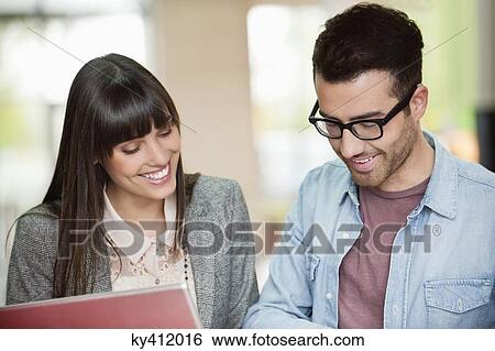 Business executives working in an office View Large Photo Image Stock Photograph - Business executives working in an office. Fotosearch
