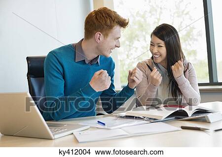 Business people showing fist and smiling View Large Photo Image Picture - Business people showing fist and smiling. Fotosearch