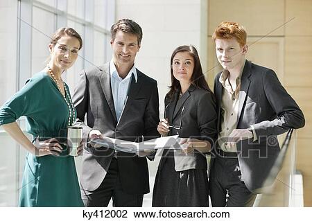 Portrait of business executives working in an office View Large Photo Image Stock Image - Portrait of business executives working in an office. Fotosearch