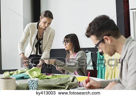 Fashion designers working in an office View Large Photo Image Stock Image - Fashion designers working in an office. Fotosearch