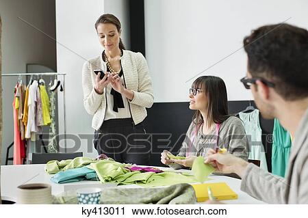 Fashion designers working in an office View Large Photo Image Stock Image - Fashion designers working in an office. Fotosearch
