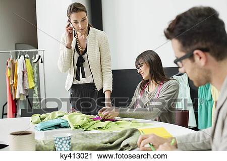 Fashion designers working in an office View Large Photo Image Stock Image - Fashion designers working in an office. Fotosearch