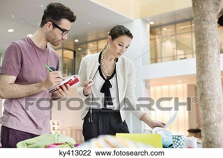 Fashion designers working in an office View Large Photo Image Stock Image - Fashion designers working in an office. Fotosearch