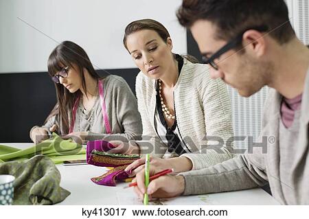 Fashion designers working in an office View Large Photo Image Stock Photo - Fashion designers working in an office. Fotosearch