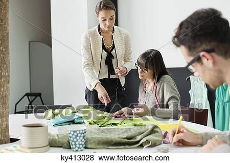 Fashion designers working in an office View Large Photo Image Stock Photo - Fashion designers working in an office. Fotosearch