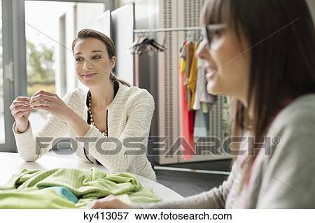 Stock Photo - Fashion designers working in an office. Fotosearch