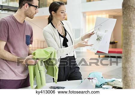 Fashion designers working in an office View Large Photo Image Stock Photograph - Fashion designers working in an office. Fotosearch