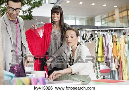 Fashion designers working in an office View Large Photo Image Stock Photograph - Fashion designers working in an office. Fotosearch