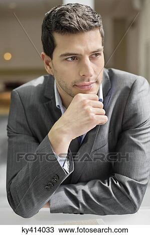 Close-up of a businessman thinking View Large Photo Image Stock Image - Close-up of a businessman thinking. Fotosearch