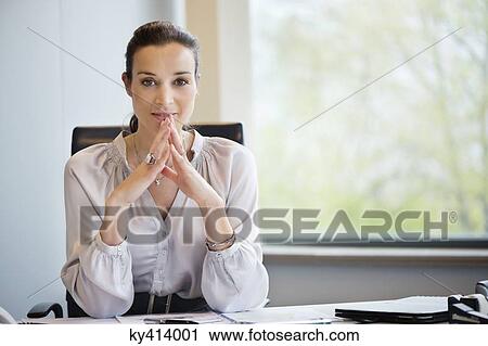 Portrait of a businesswoman in an office View Large Photo Image Stock Image - Portrait of a businesswoman in an office. Fotosearch
