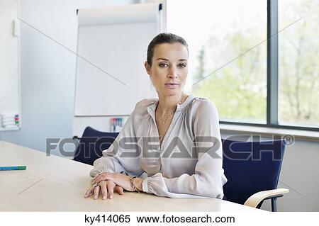Stock Photography - Portrait of a businesswoman in an office. Fotosearch