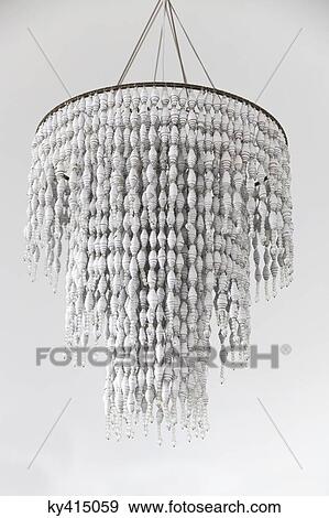 Stock Photo - Close-up of a chandelier hanging from a ceiling. Fotosearch