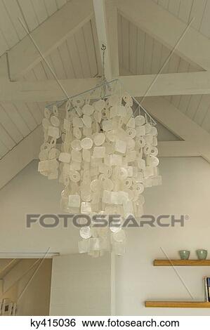Close-up of a chandelier hanging from a ceiling View Large Photo Image Stock Photograph - Close-up of a chandelier hanging from a ceiling. Fotosearch