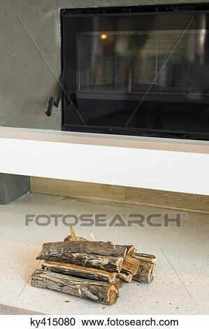 Firewood near fireplace insert View Large Photo Image Stock Image - Firewood near fireplace insert. Fotosearch