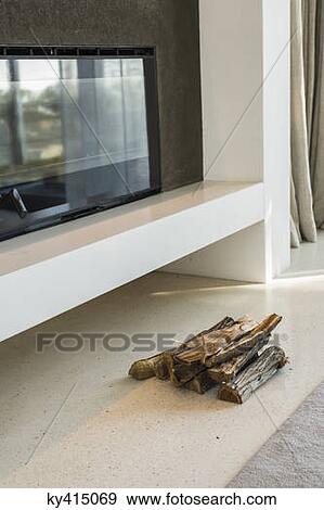 Firewood near fireplace insert View Large Photo Image Stock Photo - Firewood near fireplace insert. Fotosearch