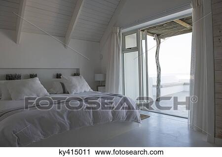 Stock Image - Interiors of a bedroom. Fotosearch