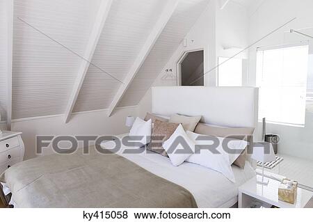 Stock Photo - Interiors of a bedroom. Fotosearch