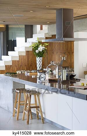 Interiors of a kitchen counter in a studio apartment View Large Photo Image Stock Photo - Interiors of a kitchen counter in a studio apartment. Fotosearch