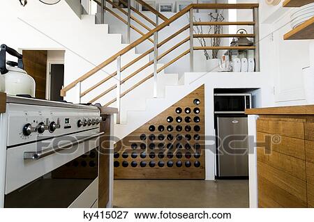 Interiors of a kitchen in a studio apartment View Large Photo Image Stock Photo - Interiors of a kitchen in a studio apartment. Fotosearch